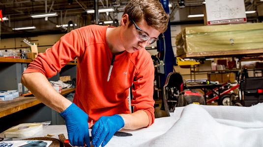 Student prepares samples for composites research.